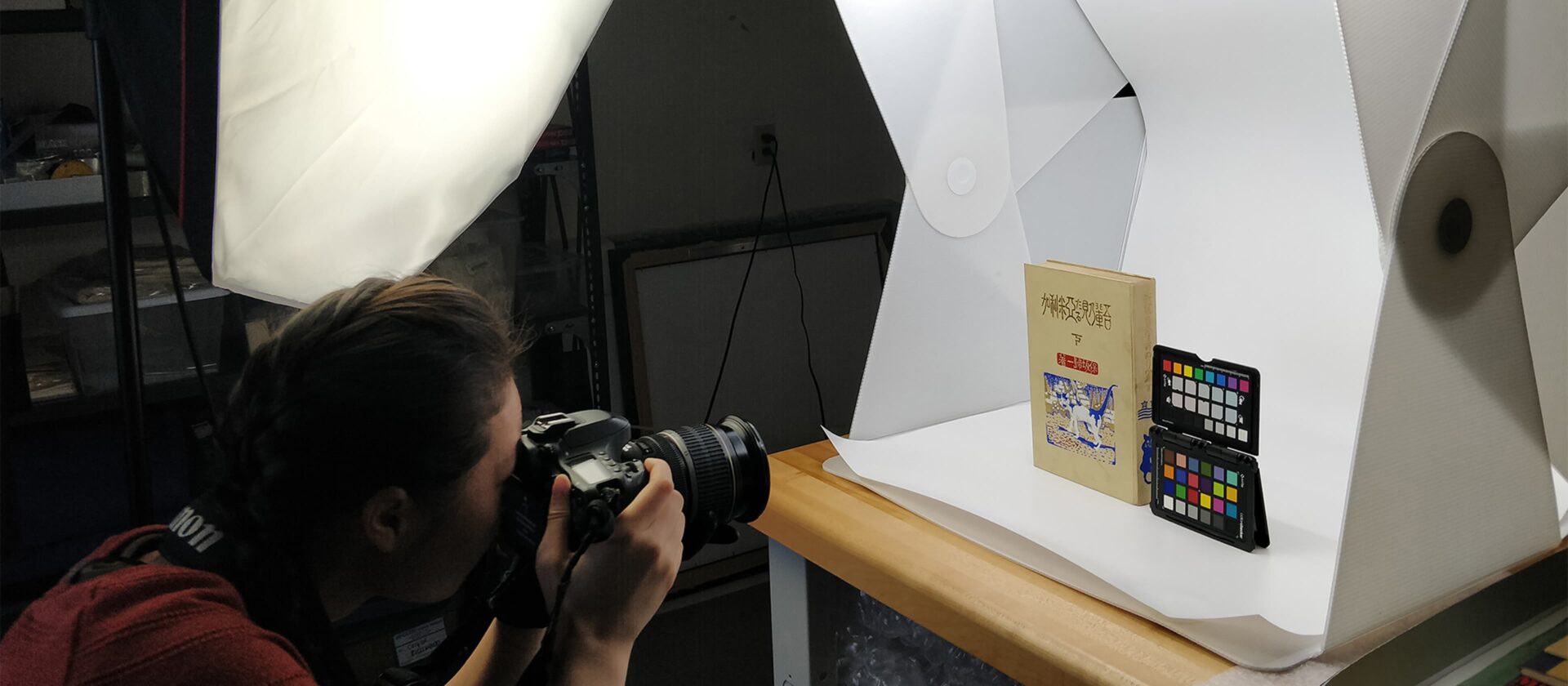 A photographer shooting a book and an object