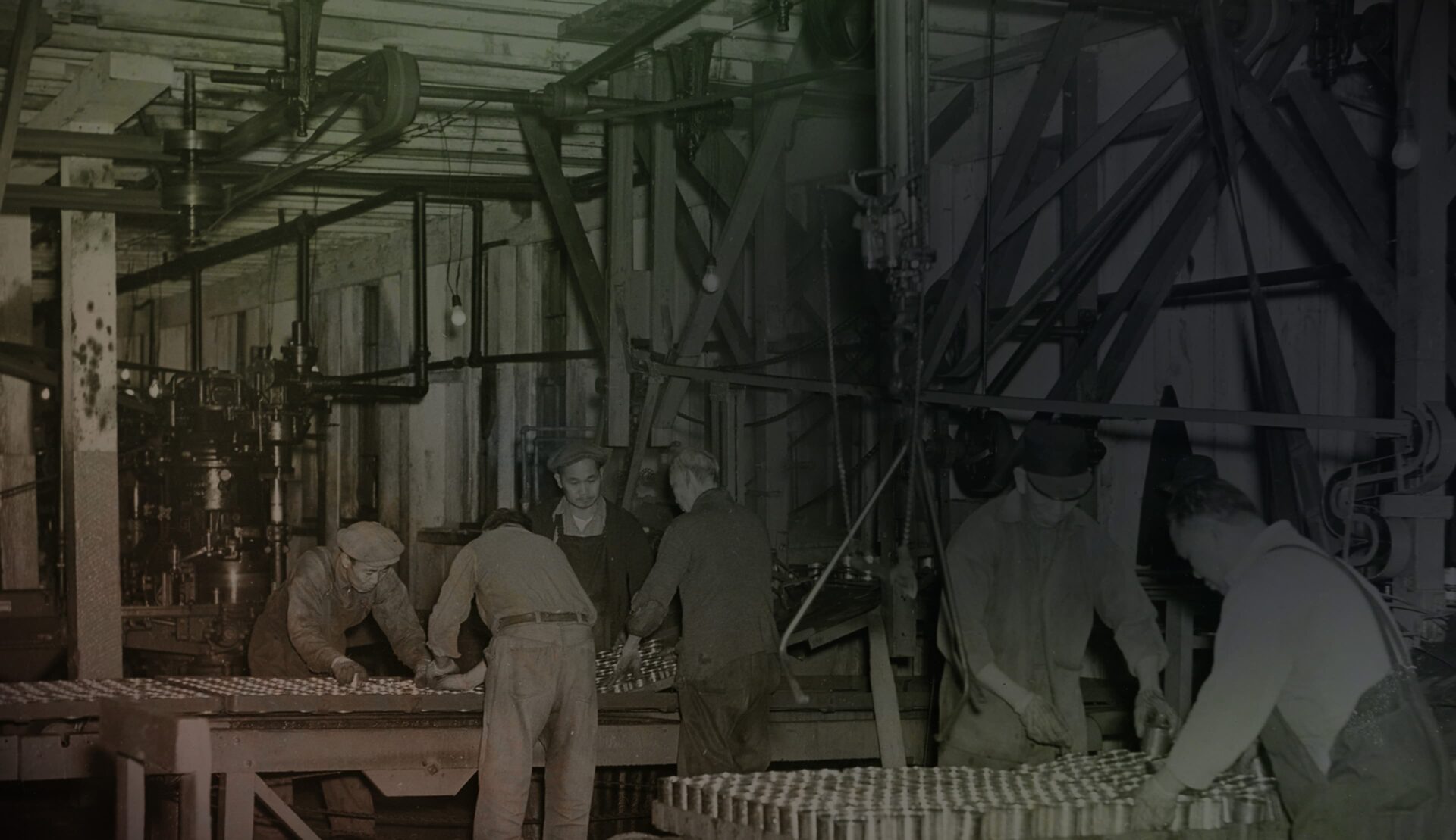 Photo of six men working in a canary factory