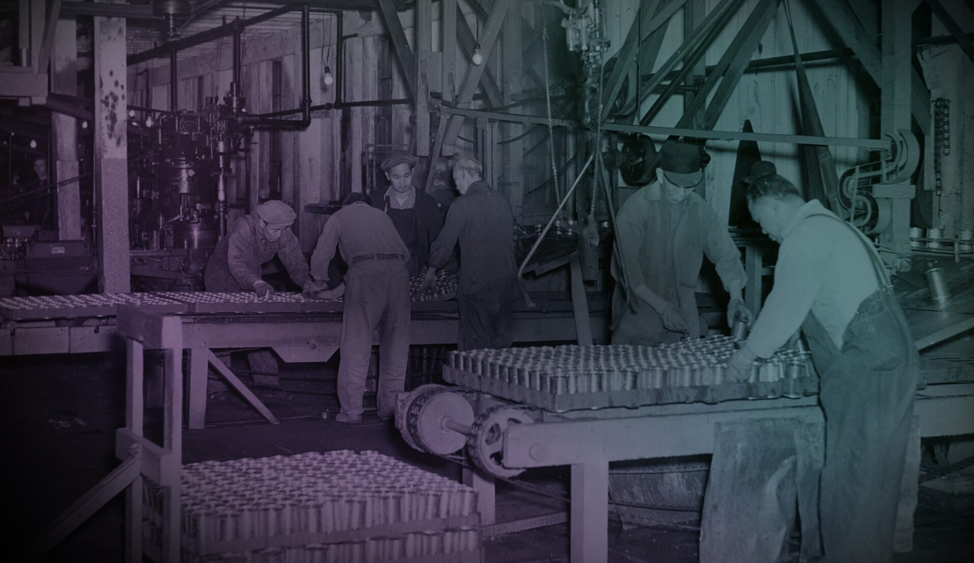 Photo of six men working in a canary factory